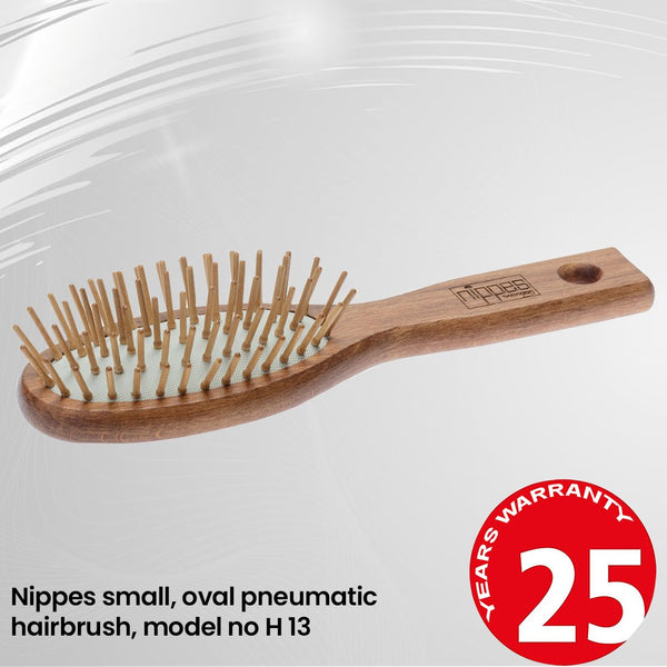 Nippes small, oval pneumatic hairbrush, with 6 rows of wooden pins, waxed beech model no H 13